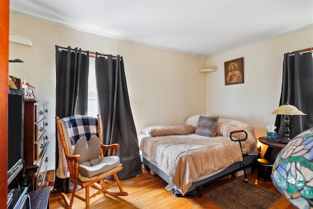 bedroom featuring hardwood / wood-style floors