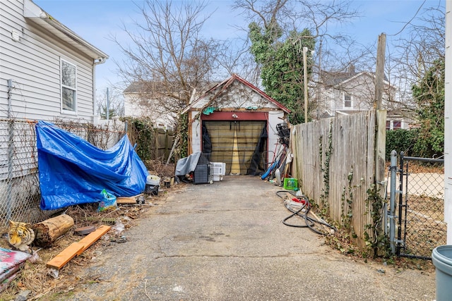 view of patio with a garage and an outdoor structure