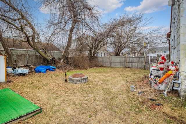 view of yard with an outdoor fire pit