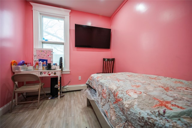 bedroom with hardwood / wood-style flooring