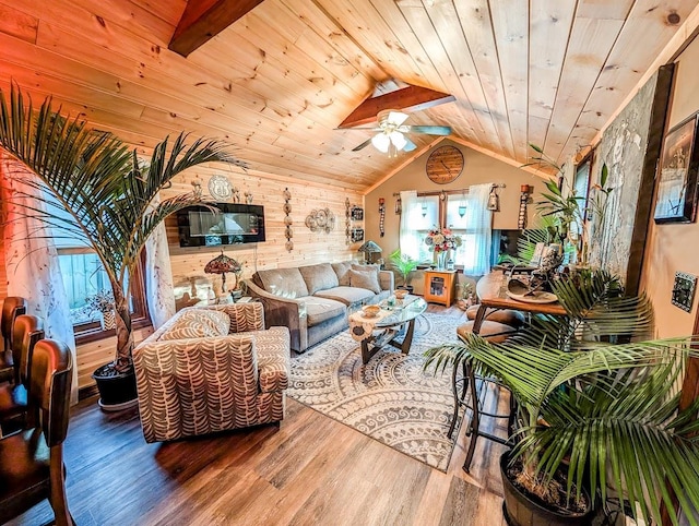 living room featuring lofted ceiling, wood-type flooring, wooden walls, and wooden ceiling