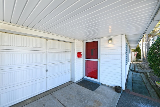 view of exterior entry featuring a garage