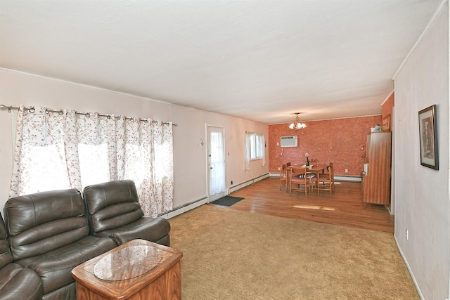 carpeted living room with a baseboard radiator, a wall mounted air conditioner, and a chandelier