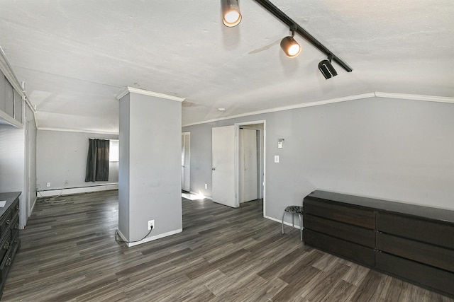 interior space with crown molding, baseboard heating, track lighting, a textured ceiling, and dark hardwood / wood-style flooring