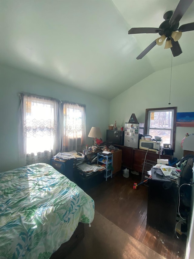 bedroom with vaulted ceiling, dark hardwood / wood-style floors, and ceiling fan