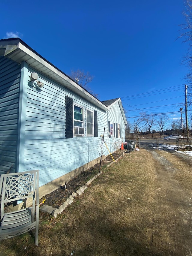 view of side of home featuring cooling unit