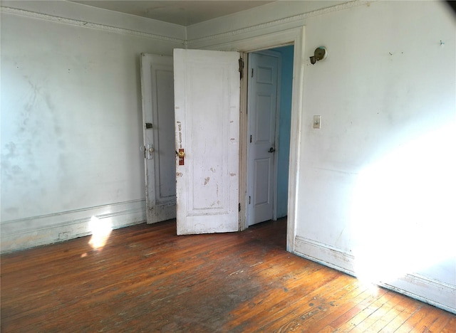 spare room featuring dark hardwood / wood-style floors