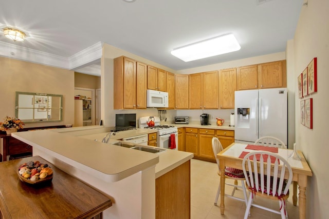 kitchen featuring sink, kitchen peninsula, crown molding, light brown cabinets, and white appliances