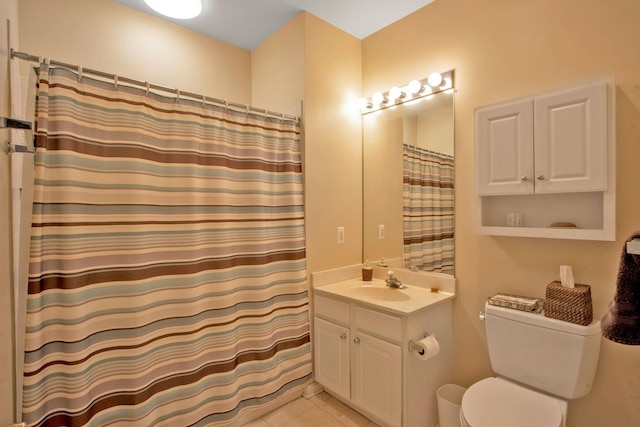 bathroom featuring vanity, curtained shower, and tile patterned flooring