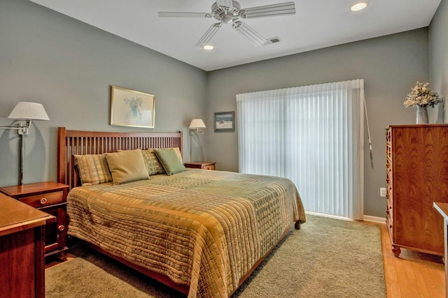 bedroom featuring ceiling fan and light hardwood / wood-style flooring