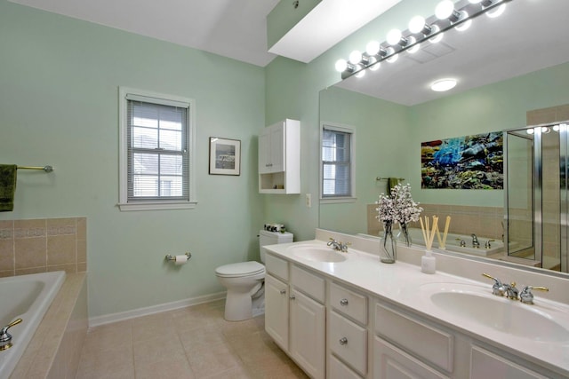 full bathroom featuring vanity, a wealth of natural light, tile patterned floors, and toilet