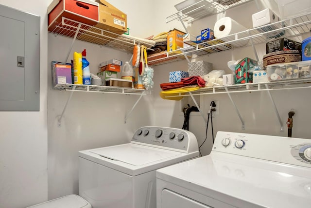 washroom featuring washing machine and dryer and electric panel