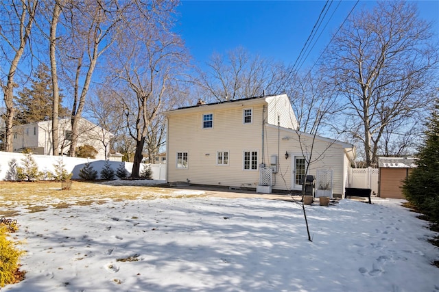 view of snow covered house