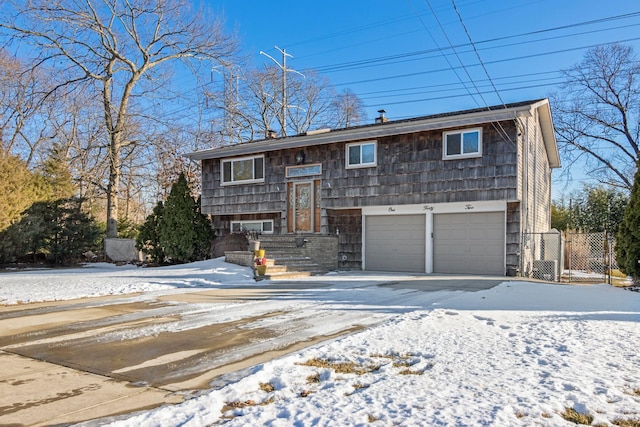 raised ranch featuring a garage