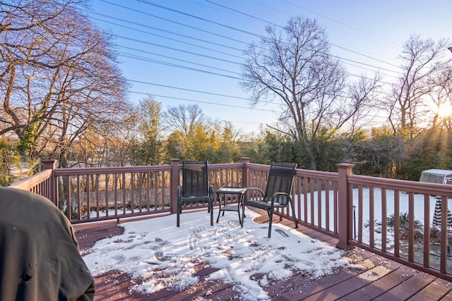 snow covered deck with area for grilling