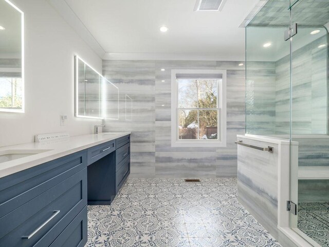 155 Pinewood Rd, Cutchogue, NY 11935 - bathroom featuring a healthy amount of sunlight, tile walls, a shower stall, and visible vents