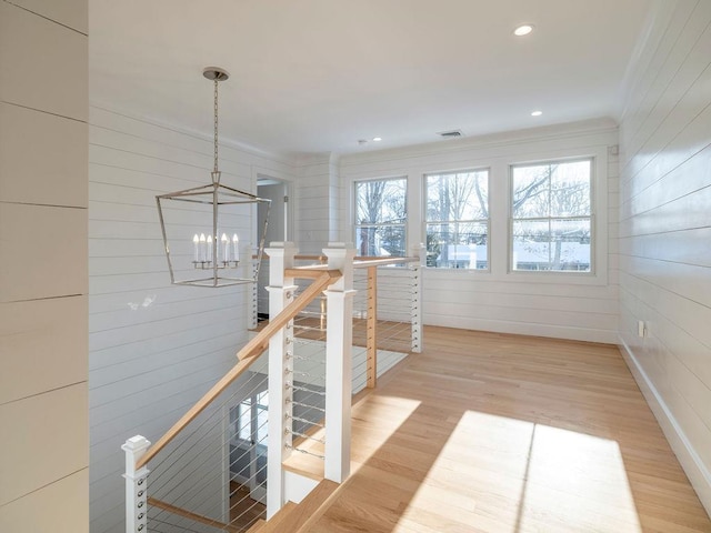 155 Pinewood Rd, Cutchogue, NY 11935 - hallway with an inviting chandelier, ornamental molding, light wood-type flooring, recessed lighting, and an upstairs landing