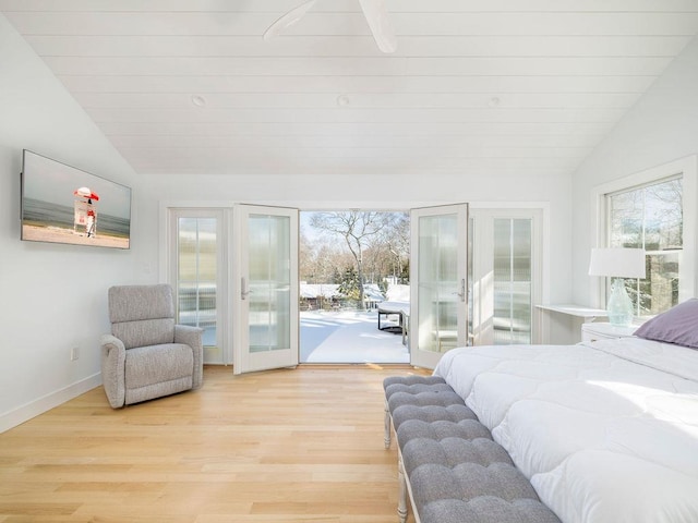 155 Pinewood Rd, Cutchogue, NY 11935 - bedroom with light wood-style floors, baseboards, lofted ceiling, and access to exterior