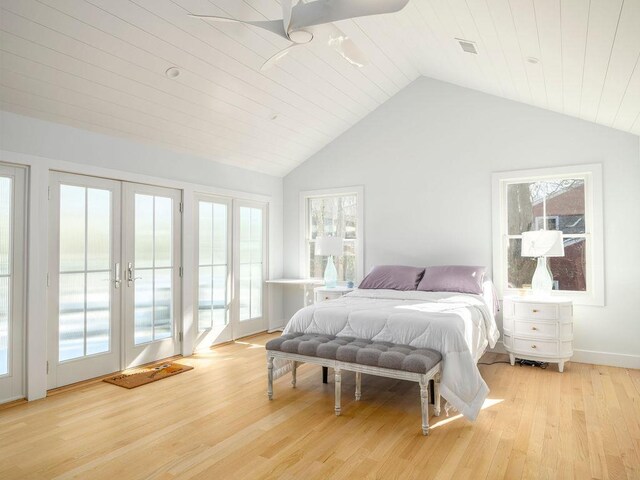 155 Pinewood Rd, Cutchogue, NY 11935 - bedroom with light wood-style flooring, lofted ceiling, multiple windows, and access to exterior