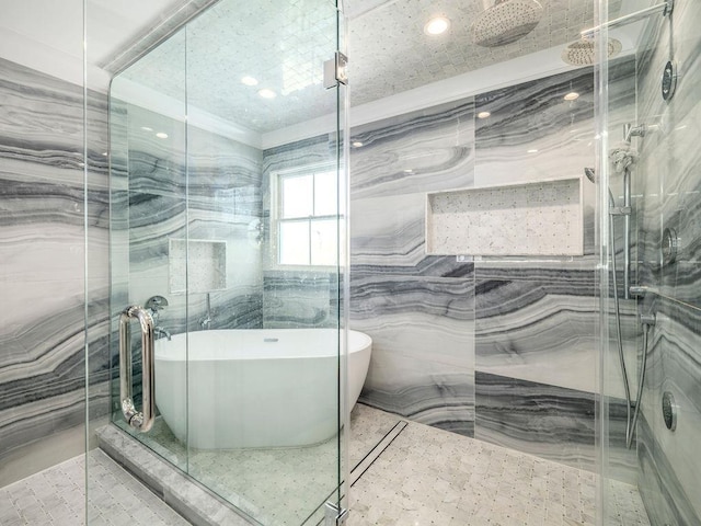 155 Pinewood Rd, Cutchogue, NY 11935 - bathroom featuring a soaking tub, tile walls, a marble finish shower, and recessed lighting