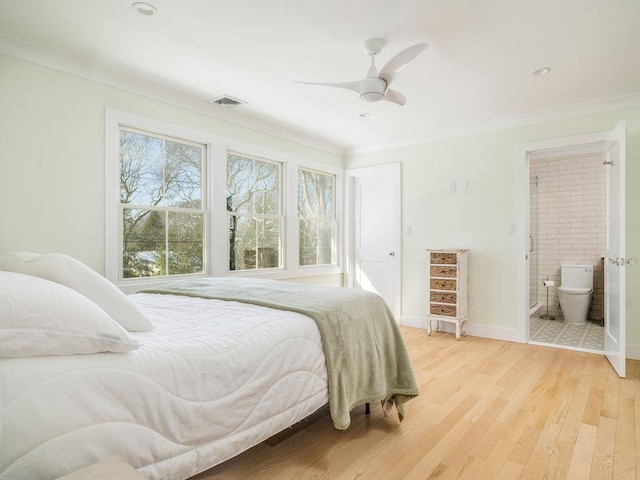 155 Pinewood Rd, Cutchogue, NY 11935 - bedroom with ensuite bathroom, visible vents, light wood-type flooring, baseboards, and ornamental molding