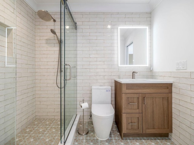 155 Pinewood Rd, Cutchogue, NY 11935 - bathroom with crown molding, vanity, a stall shower, and tile walls