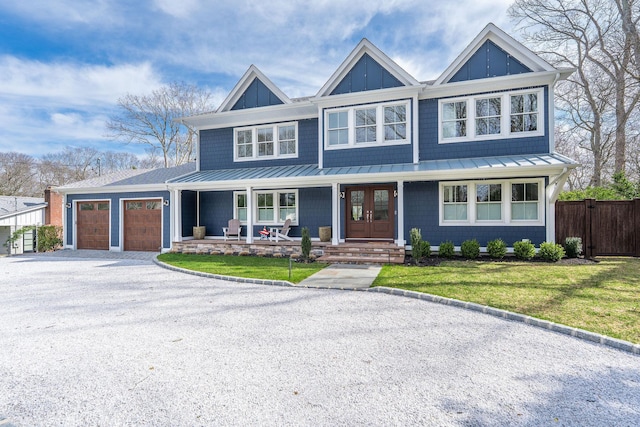 155 Pinewood Rd, Cutchogue, NY 11935 - craftsman inspired home featuring covered porch, an attached garage, a standing seam roof, and driveway
