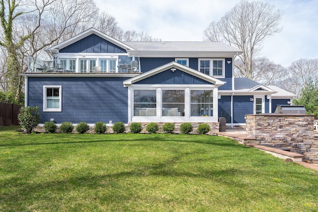 155 Pinewood Rd, Cutchogue, NY 11935 - view of front of house featuring a sunroom, a front lawn, board and batten siding, and area for grilling