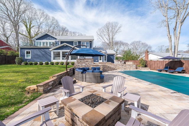 155 Pinewood Rd, Cutchogue, NY 11935 - view of patio featuring a fenced in pool, an outdoor living space with a fire pit, and a fenced backyard