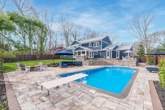 155 Pinewood Rd, Cutchogue, NY 11935 - view of pool featuring a fenced backyard, an outdoor living space with a fire pit, and a patio area