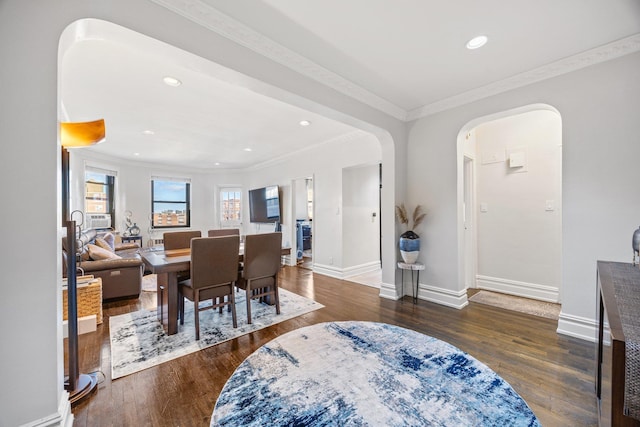 interior space featuring dark wood-type flooring and crown molding