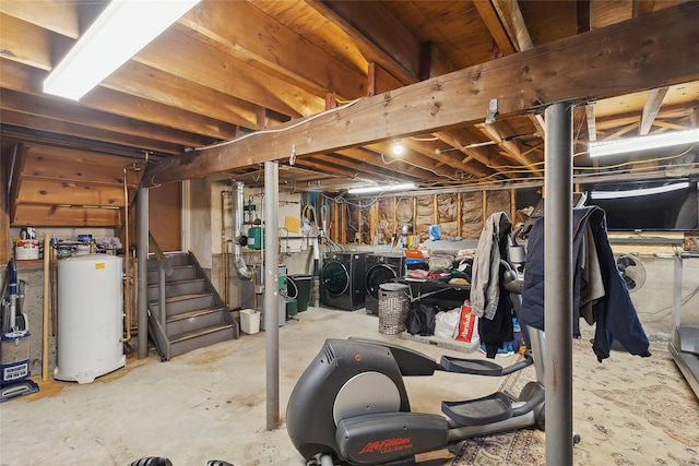 basement featuring gas water heater and washing machine and clothes dryer