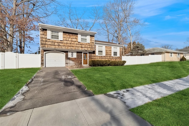 tri-level home with a garage and a front lawn