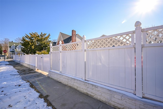 view of snow covered gate