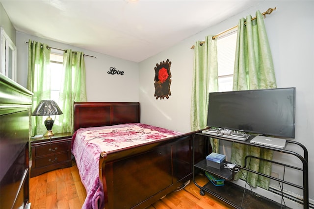 bedroom with wood-type flooring