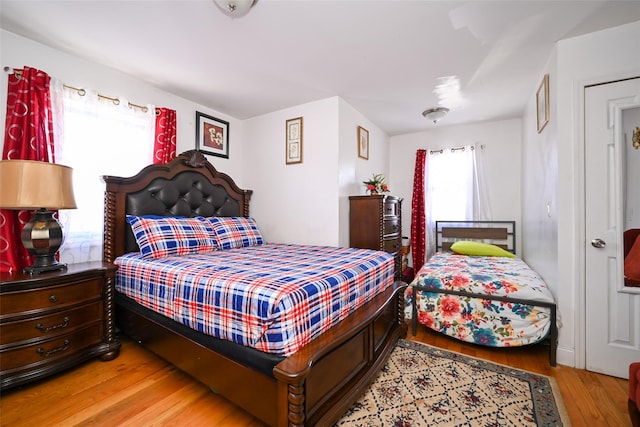 bedroom featuring hardwood / wood-style flooring