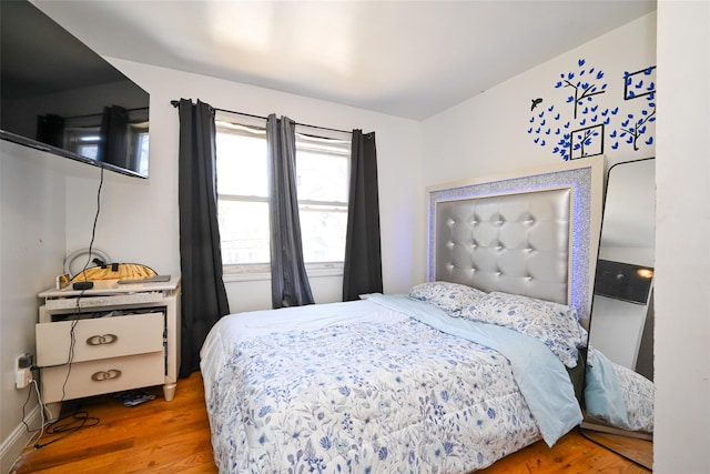 bedroom featuring hardwood / wood-style flooring