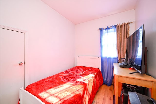 bedroom with light hardwood / wood-style floors