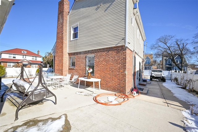 back of property featuring a patio