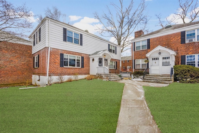 view of front of home with an outbuilding and a front yard