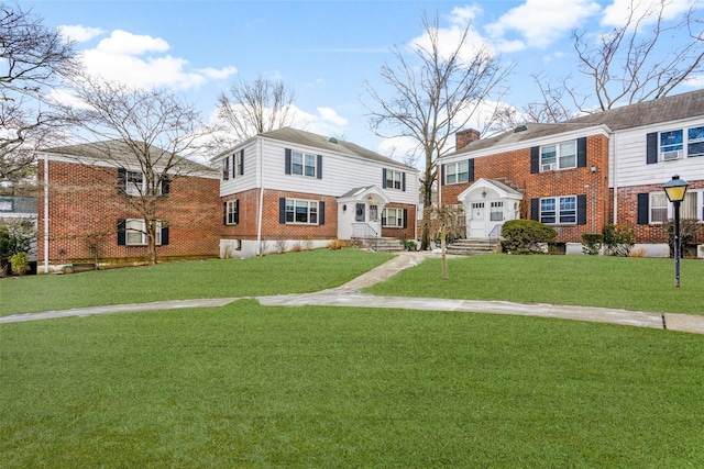 view of front of home with a front lawn