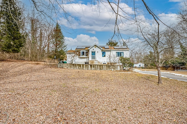 view of front of property with solar panels