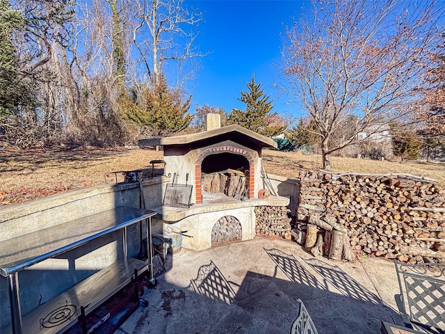 view of patio / terrace with a fireplace