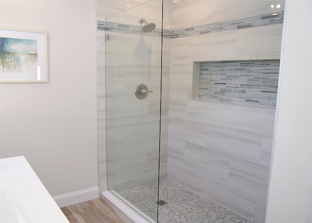 bathroom with a tile shower