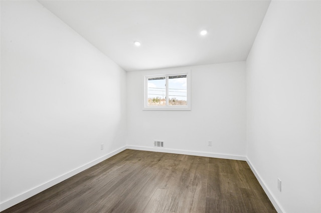 unfurnished room with dark hardwood / wood-style floors