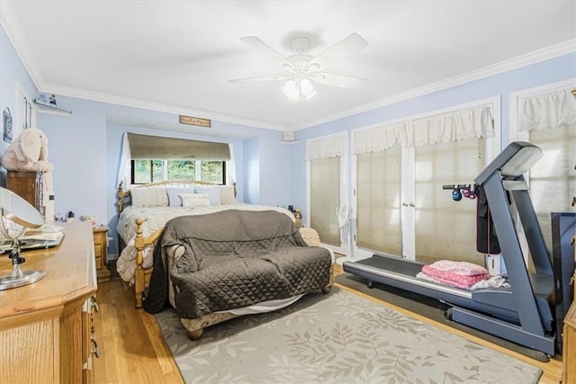 bedroom with ceiling fan, ornamental molding, and hardwood / wood-style floors