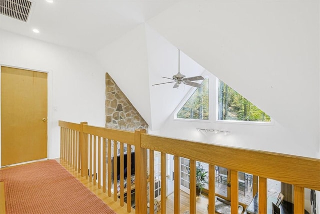 hall featuring vaulted ceiling