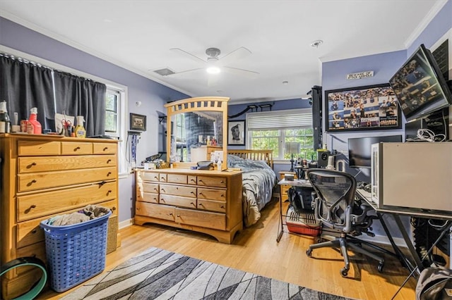 bedroom featuring light hardwood / wood-style flooring, ornamental molding, and ceiling fan