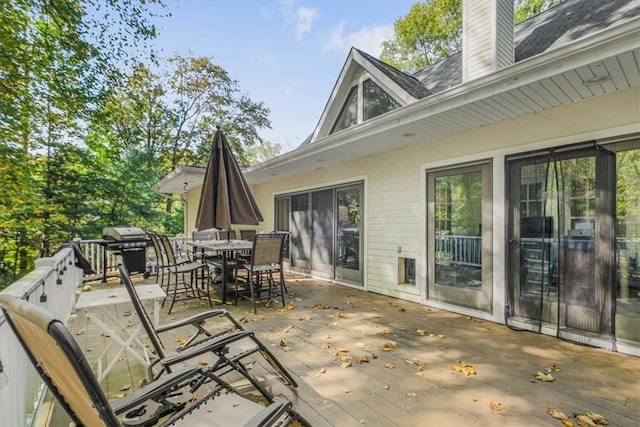 wooden terrace featuring grilling area