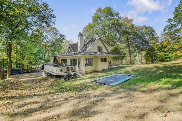 back of house featuring a deck